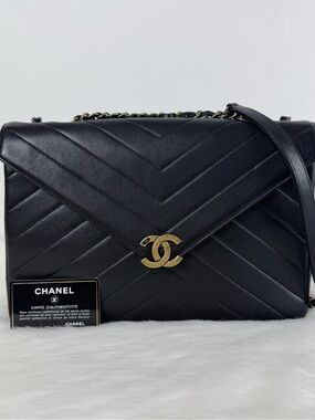 CHANEL Black Chevron Quilted Shoulder Bag with Gold CC
